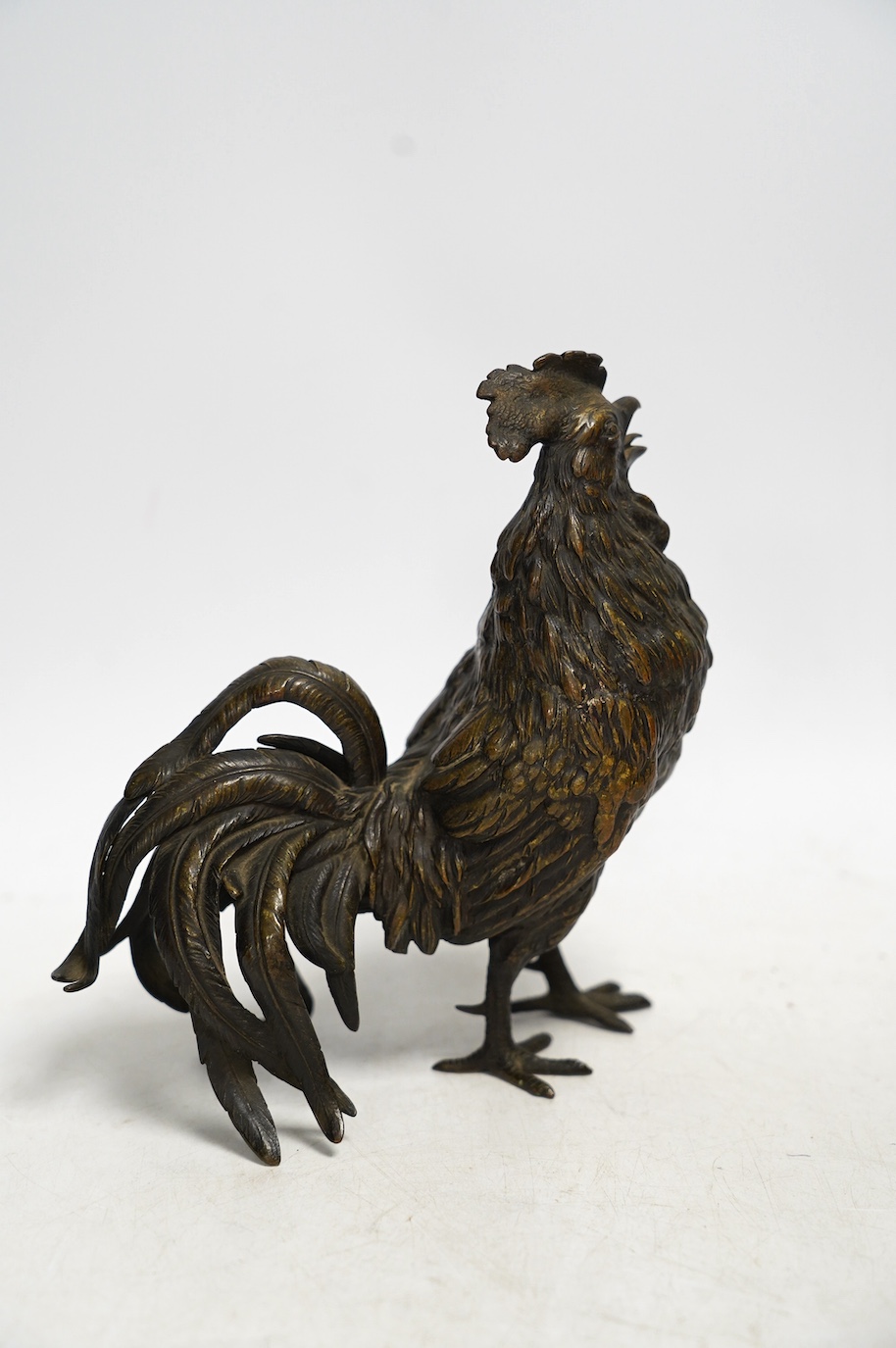 A bronze study of a cockerel, 17cm. Condition - good